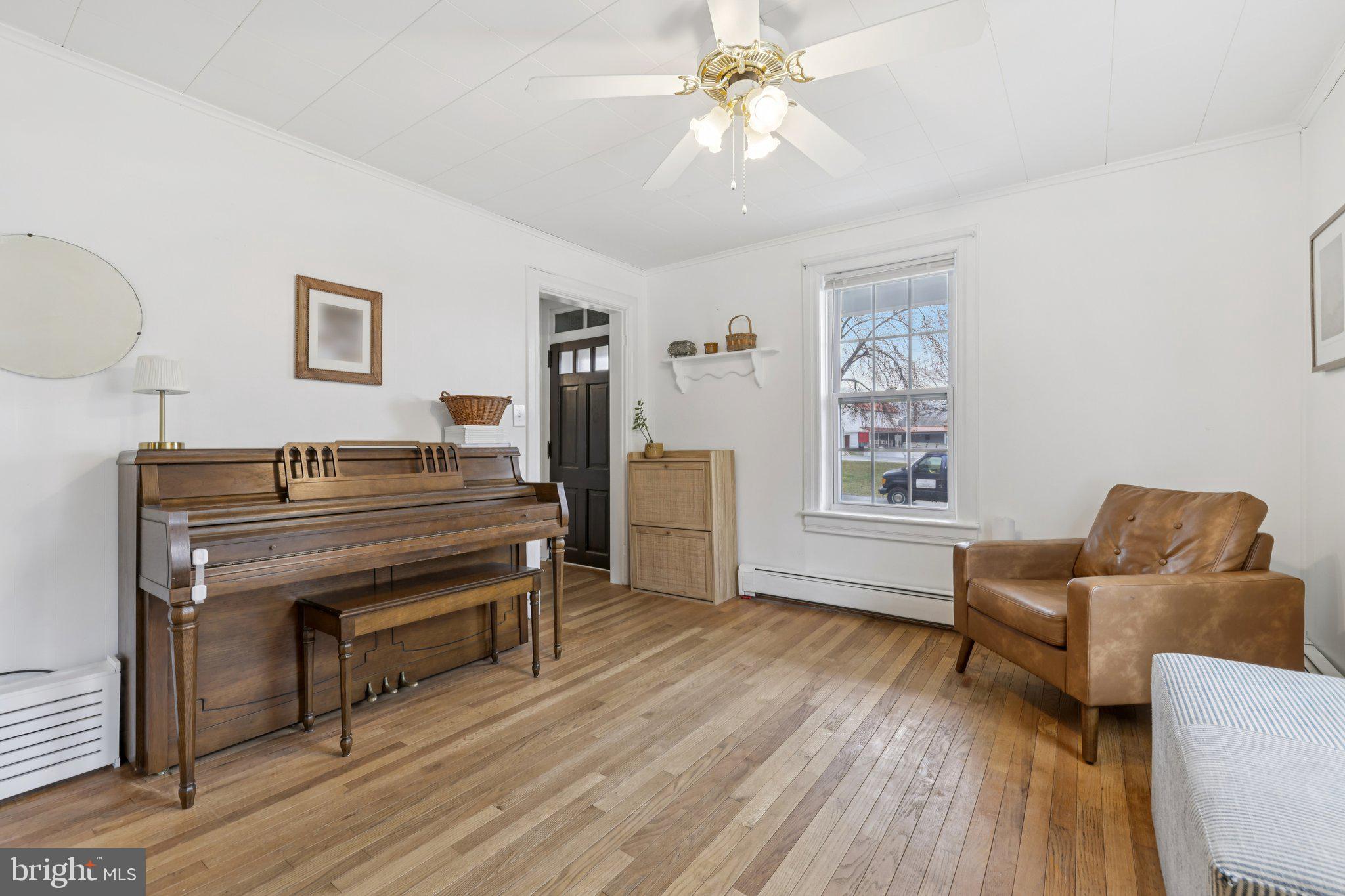 22538 Old Georgetown Road Smithsburg, MD 21783 - Photo 8 of 50 a living room with furniture and a wooden floor