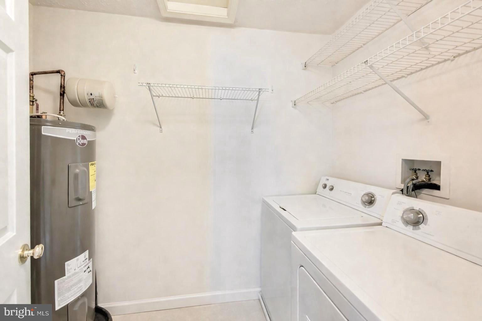 687 Winding Stream Way, Unit 304 Odenton, MD 21113 - Photo 18 of 33 a utility room with dryer and washer