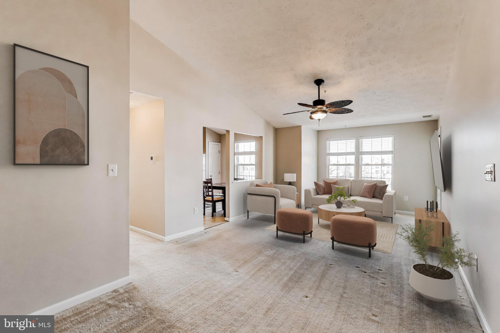 687 Winding Stream Way, Unit 304 Odenton, MD 21113 - Photo 2 of 33 a living room with furniture a chandelier and a window