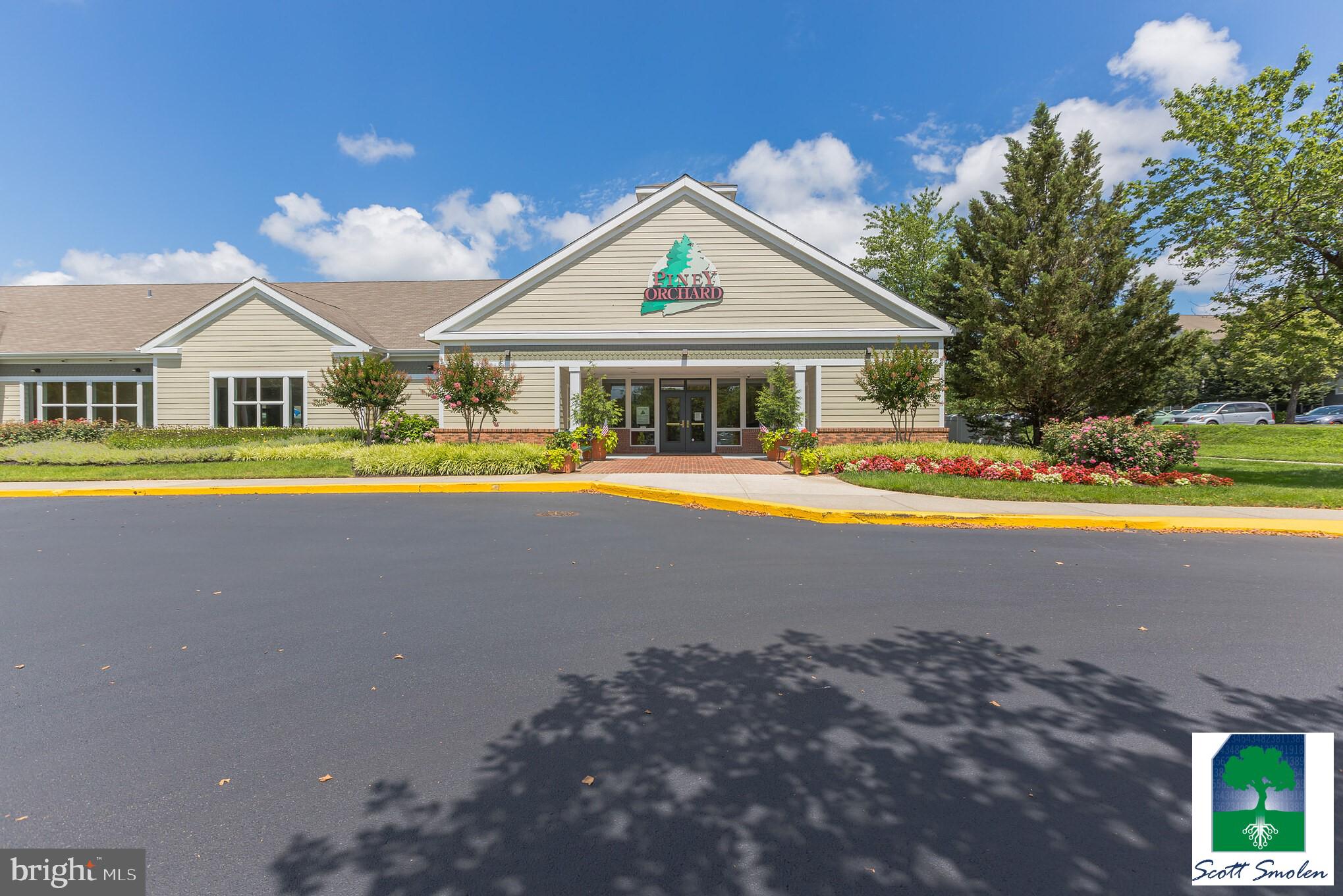 687 Winding Stream Way, Unit 304 Odenton, MD 21113 - Photo 21 of 33 a view of a house with a big yard and large trees