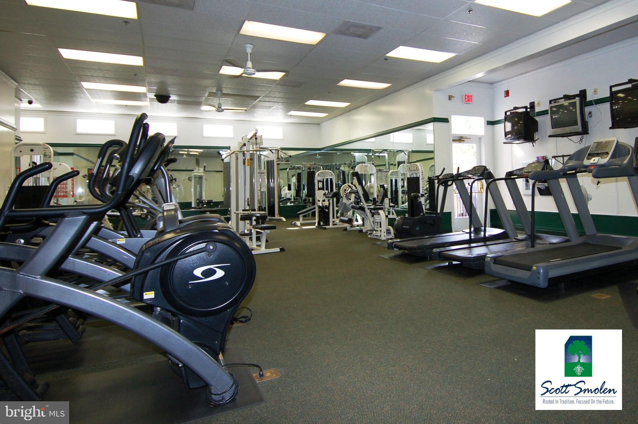 687 Winding Stream Way, Unit 304 Odenton, MD 21113 - Photo 23 of 33 a view of a room with gym equipment