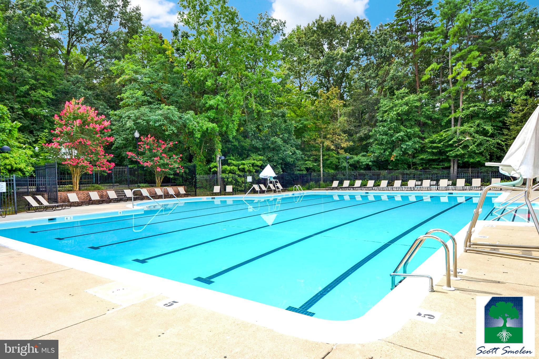 687 Winding Stream Way, Unit 304 Odenton, MD 21113 - Photo 30 of 33 a view of a tennis ground with large trees