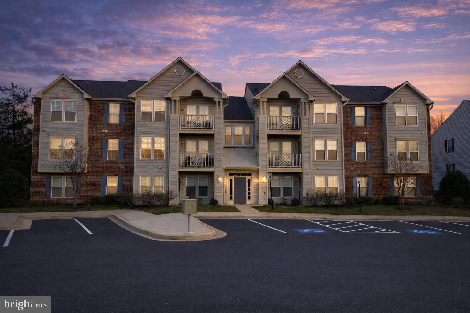 687 Winding Stream Way, Unit 304 Odenton, MD 21113 - Photo 33 of 33 a front view of brick house with a yard