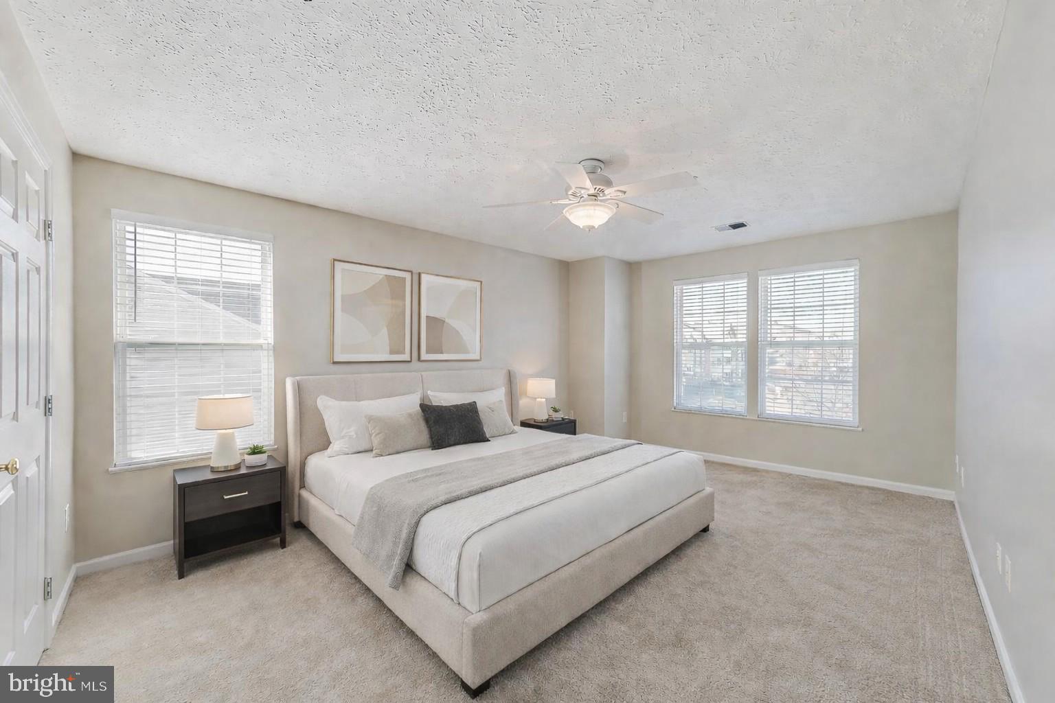 687 Winding Stream Way, Unit 304 Odenton, MD 21113 - Photo 4 of 33 a bedroom with a bed and a window