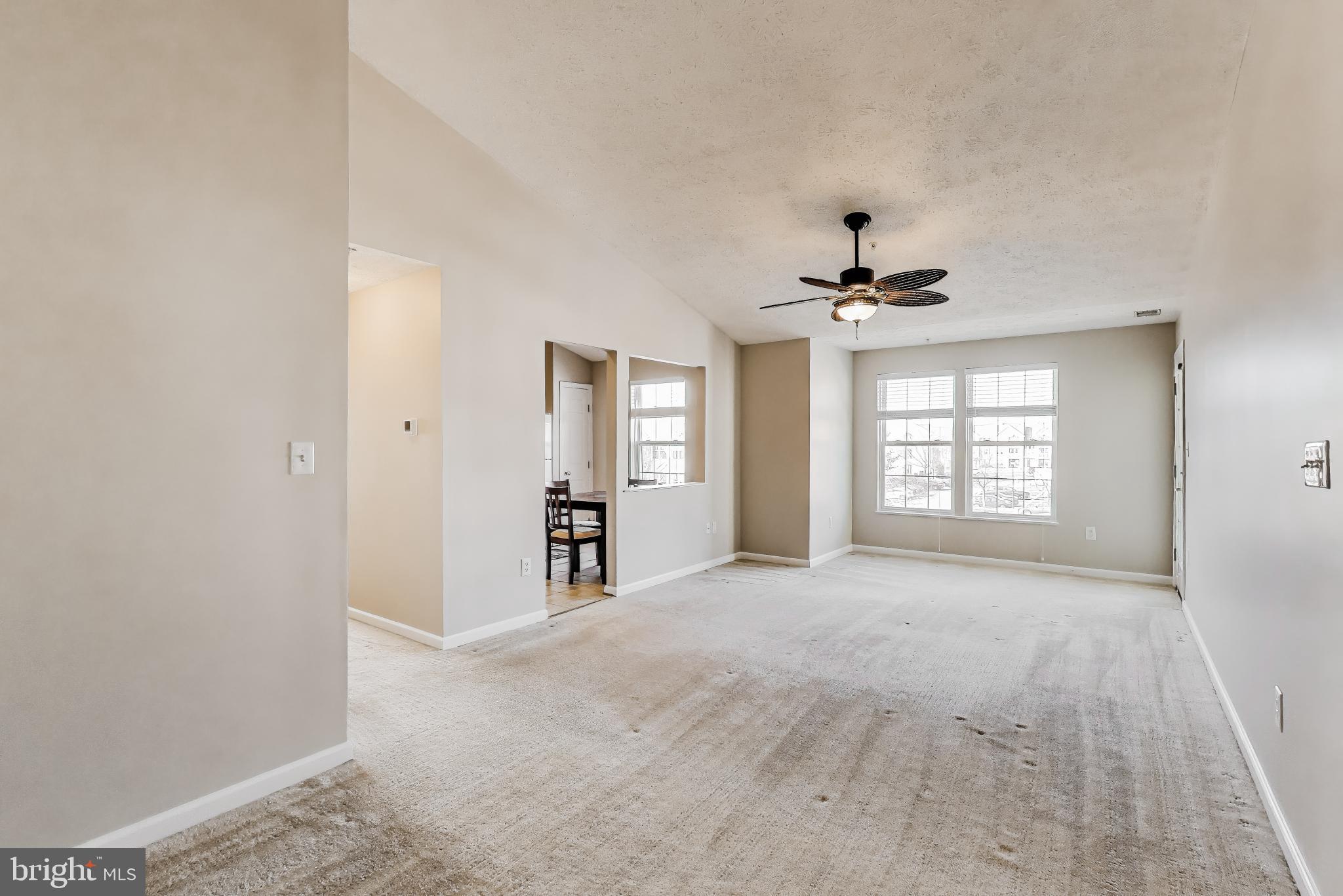 687 Winding Stream Way, Unit 304 Odenton, MD 21113 - Photo 6 of 33 a view of an empty room with a window