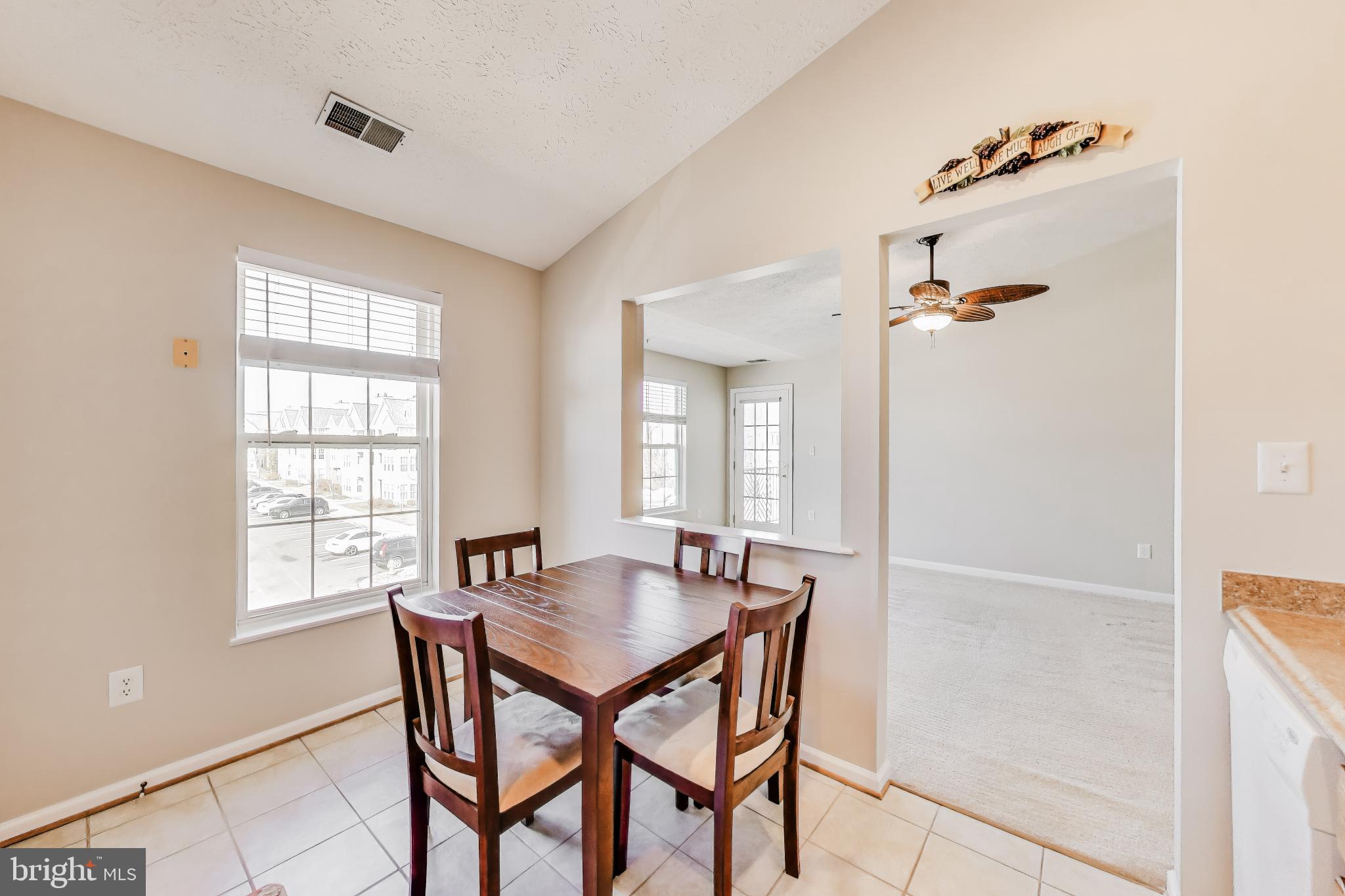 687 Winding Stream Way, Unit 304 Odenton, MD 21113 - Photo 9 of 33 a view of a dining room with furniture and window