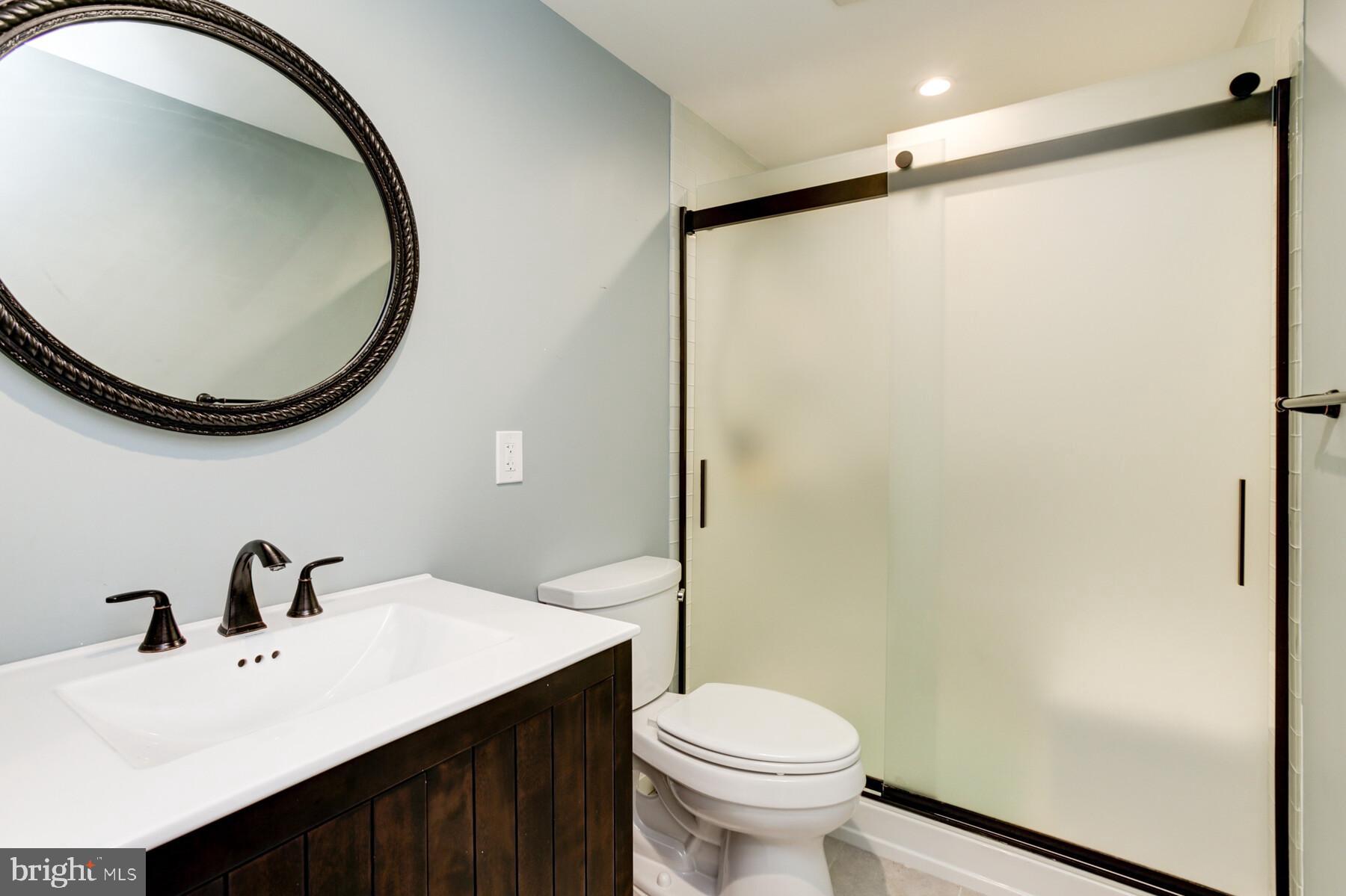 307 Saddle Ridge Road Annapolis, MD 21403 - Photo 36 of 46 a bathroom with a sink and a mirror