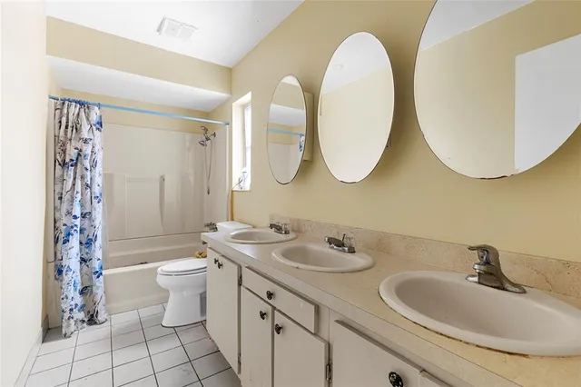 a bathroom with a toilet and shower