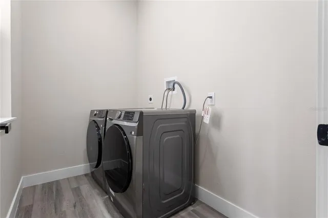 a view of storage and utility room with washer and dryer