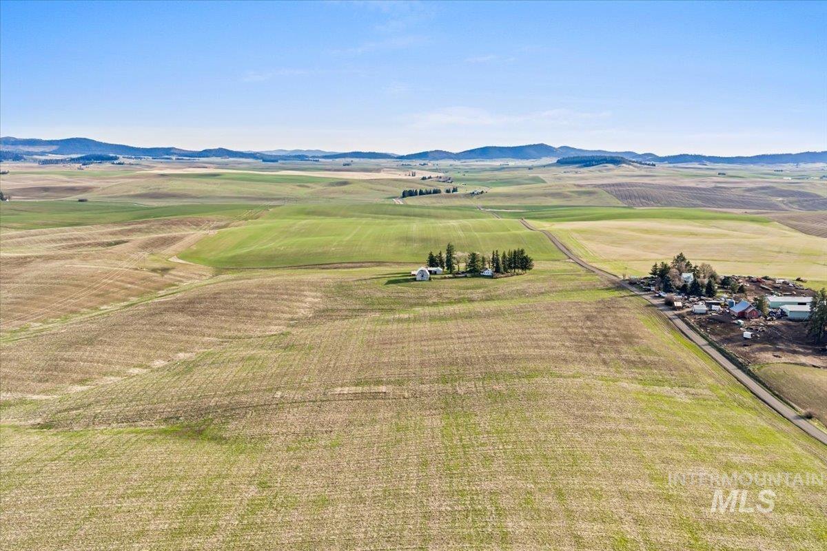 19454 Idaho Road Worley, ID 83876 - Photo 38 of 50 Aerial view of sparsely populated area featuring abundant farmland and mountains