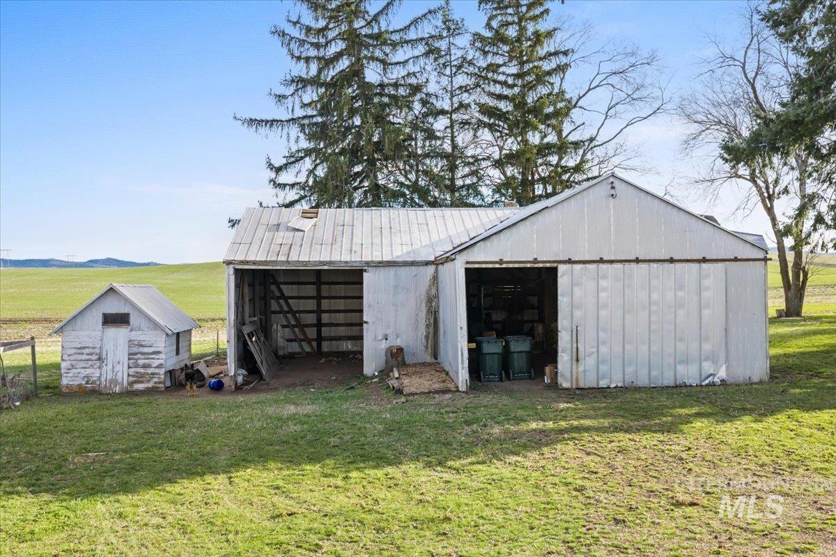 19454 Idaho Road Worley, ID 83876 - Photo 42 of 50 View of pole building featuring a lawn and a view of countryside