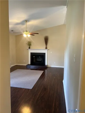 a view of empty room with a fireplace