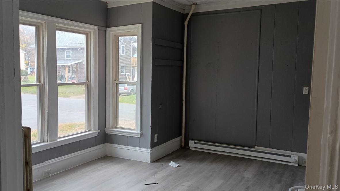 10 Church Avenue, Unit 7 Roscoe, NY 12776 - Photo 2 of 5 a view of an empty room and window