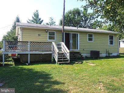 308 West 6th Avenue Ranson, WV 25438 - Photo 2 of 7 a front view of a house with a garden