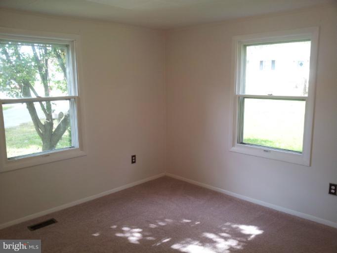 308 West 6th Avenue Ranson, WV 25438 - Photo 5 of 7 an empty room with a window