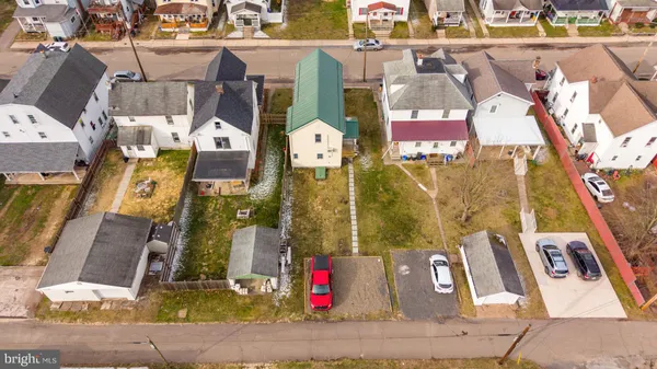 an aerial view of residential houses with outdoor space