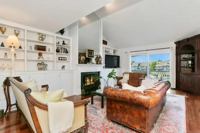 a living room with furniture fireplace and a flat screen tv