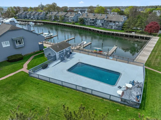 an aerial view of a house with a lake view