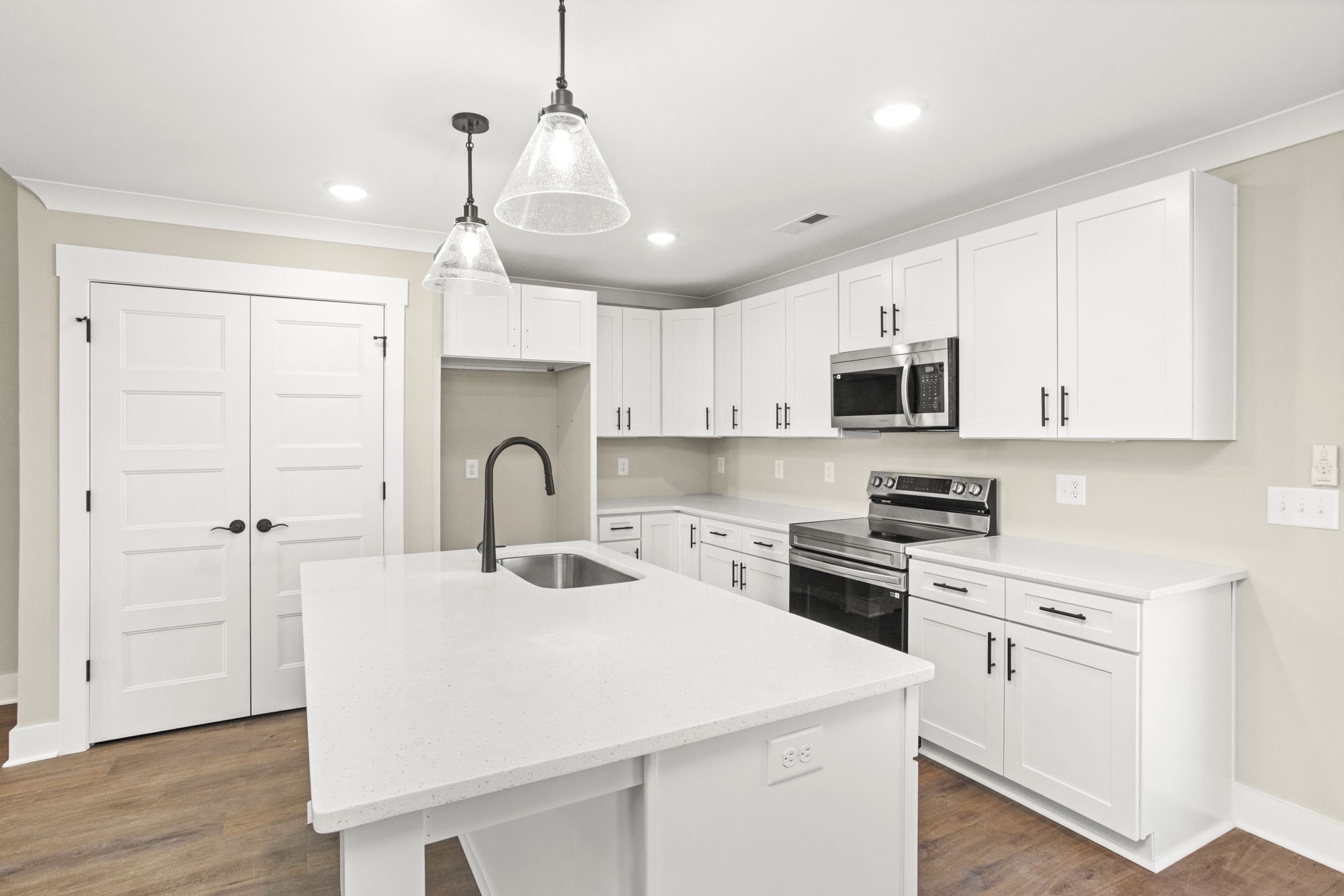 381 Copperas Creek Road Tullahoma, TN 37388 - Photo 11 of 44 a kitchen with kitchen island a sink stainless steel appliances and cabinets