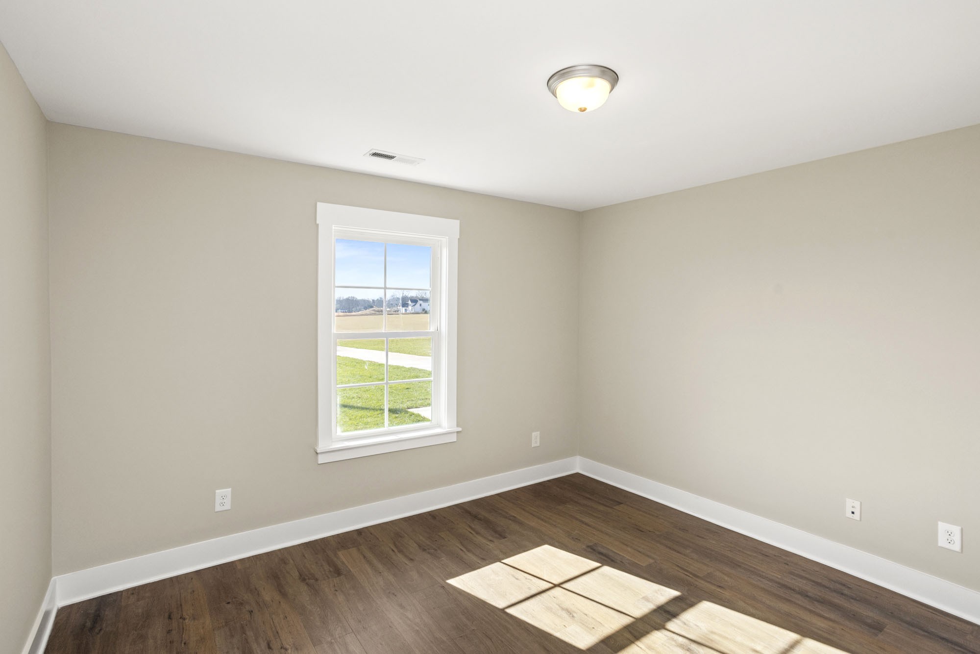 381 Copperas Creek Road Tullahoma, TN 37388 - Photo 18 of 44 a view of wooden floor and windows in a room