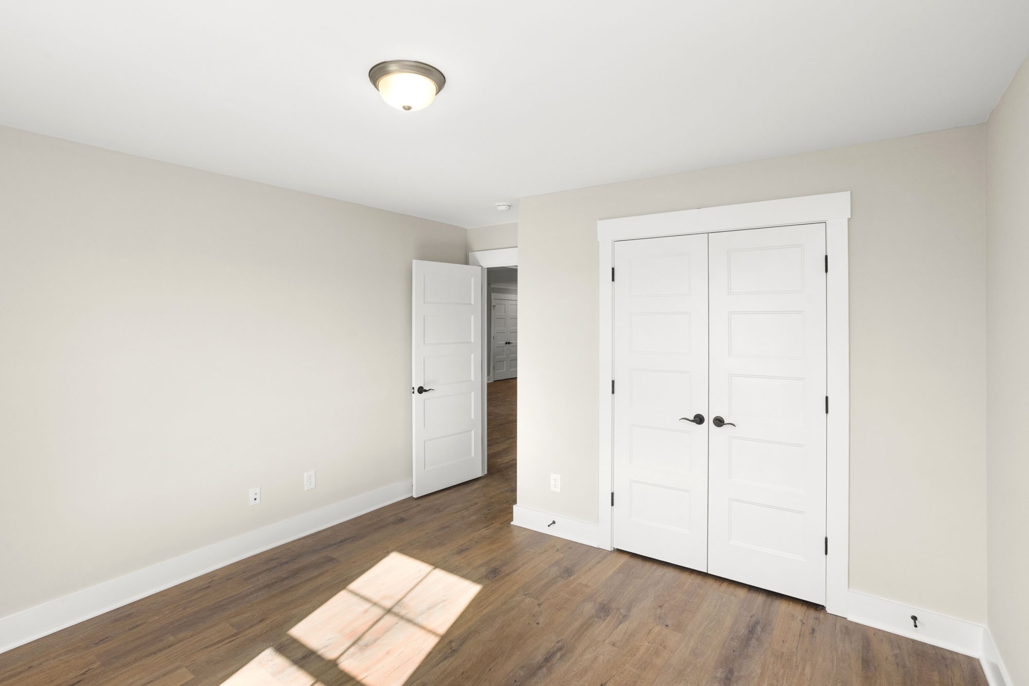 381 Copperas Creek Road Tullahoma, TN 37388 - Photo 19 of 44 a view of an empty room and wooden floor