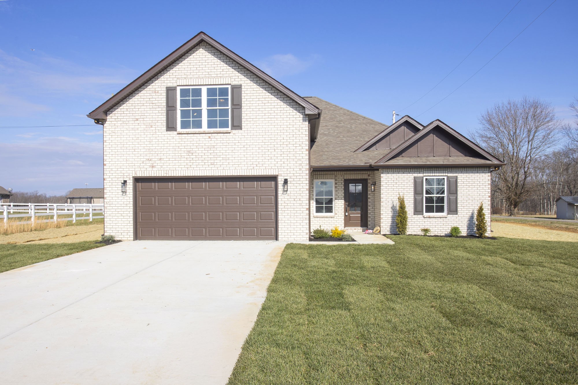 381 Copperas Creek Road Tullahoma, TN 37388 - Photo 2 of 44 a front view of a house with a yard and garage