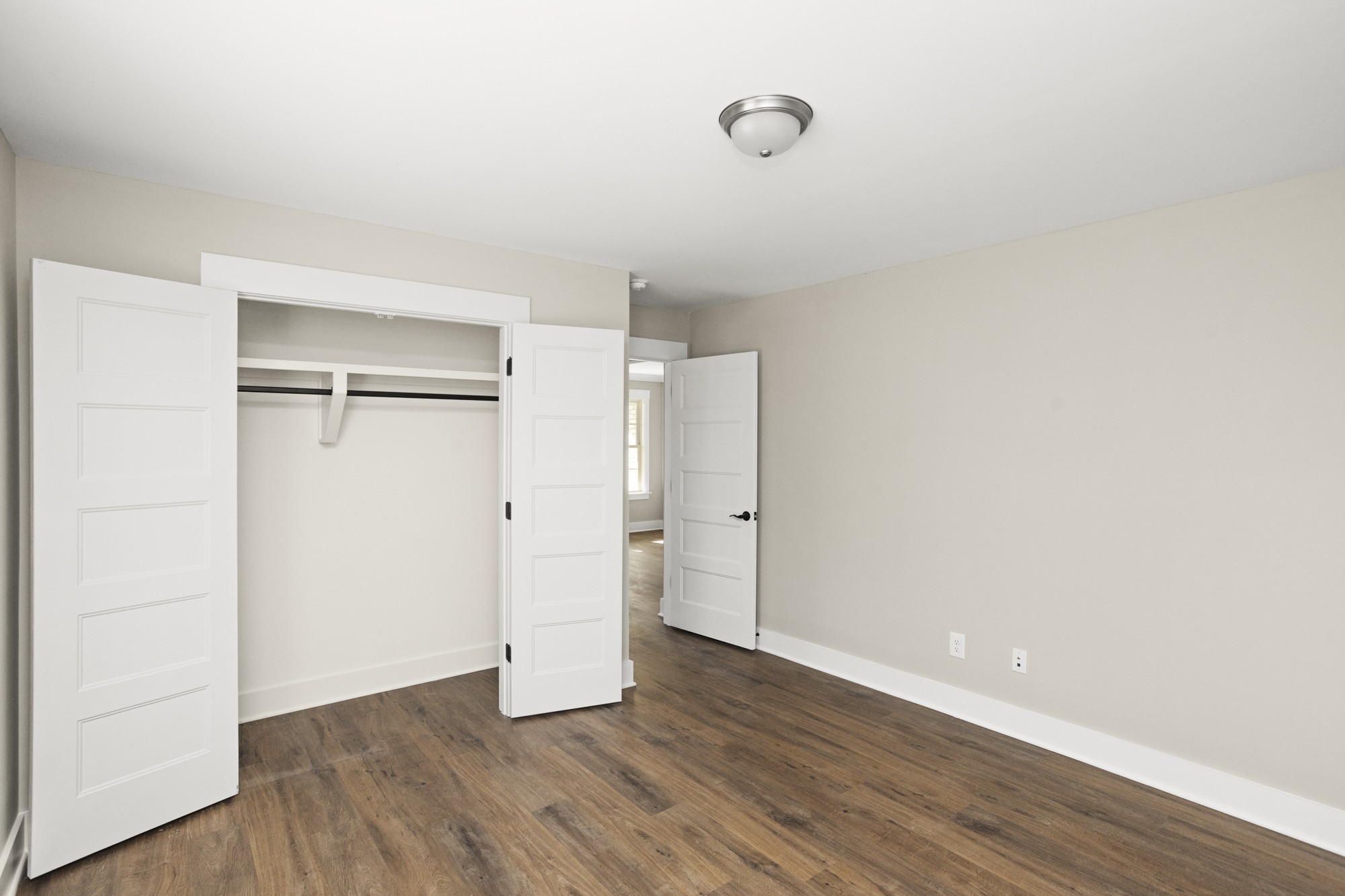 381 Copperas Creek Road Tullahoma, TN 37388 - Photo 23 of 44 a view of an empty room with wooden floor