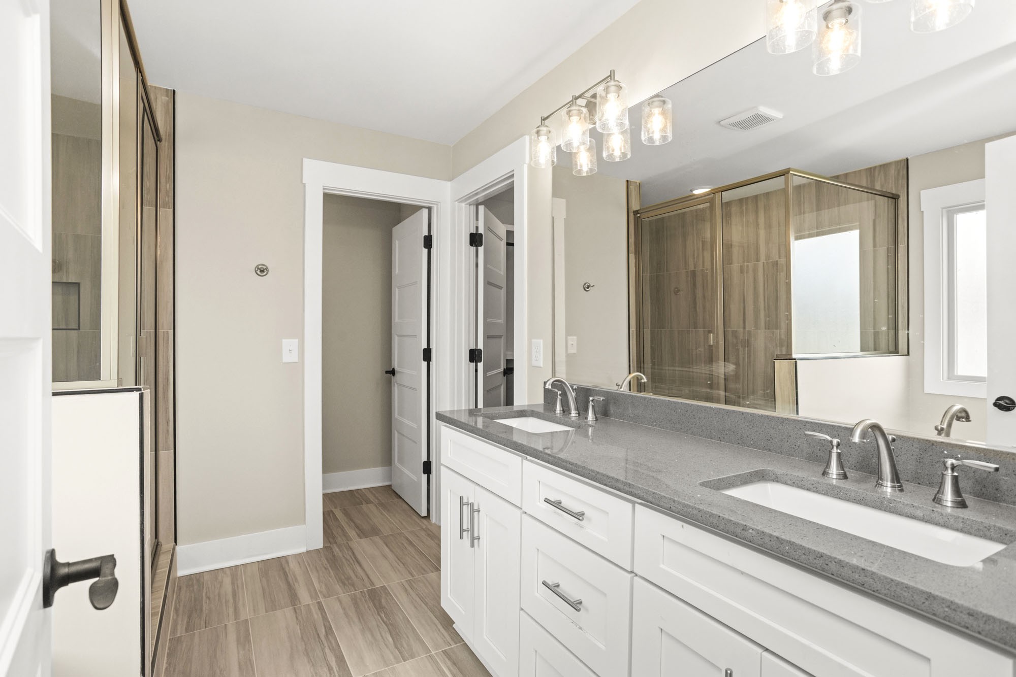 381 Copperas Creek Road Tullahoma, TN 37388 - Photo 29 of 44 a bathroom with a double vanity sink and mirror