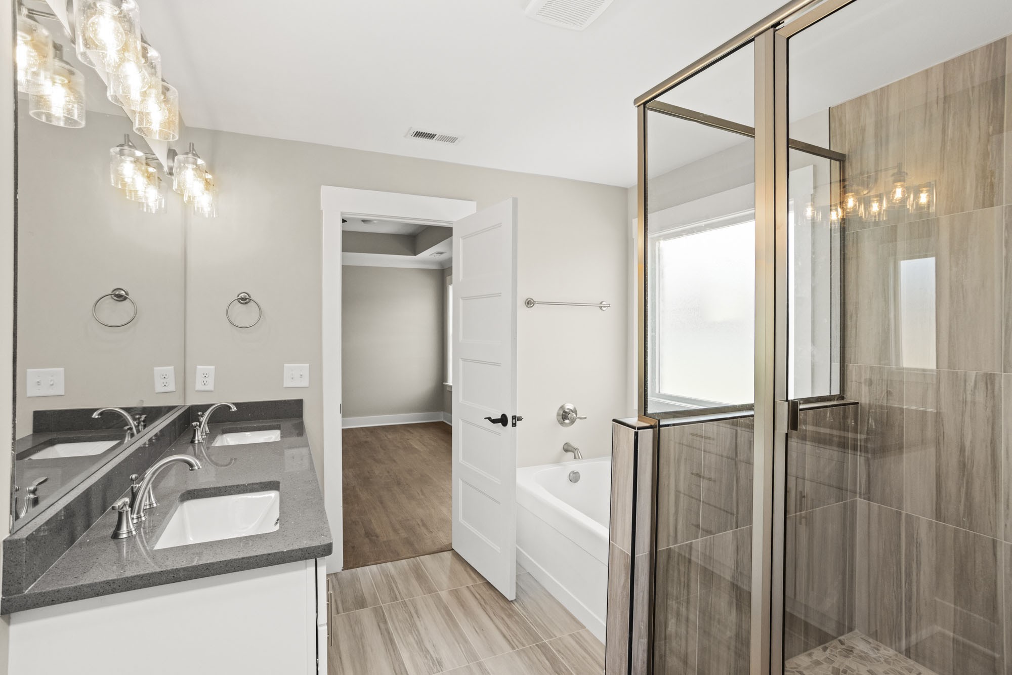 381 Copperas Creek Road Tullahoma, TN 37388 - Photo 32 of 44 a bathroom with a granite countertop sink mirror and shower