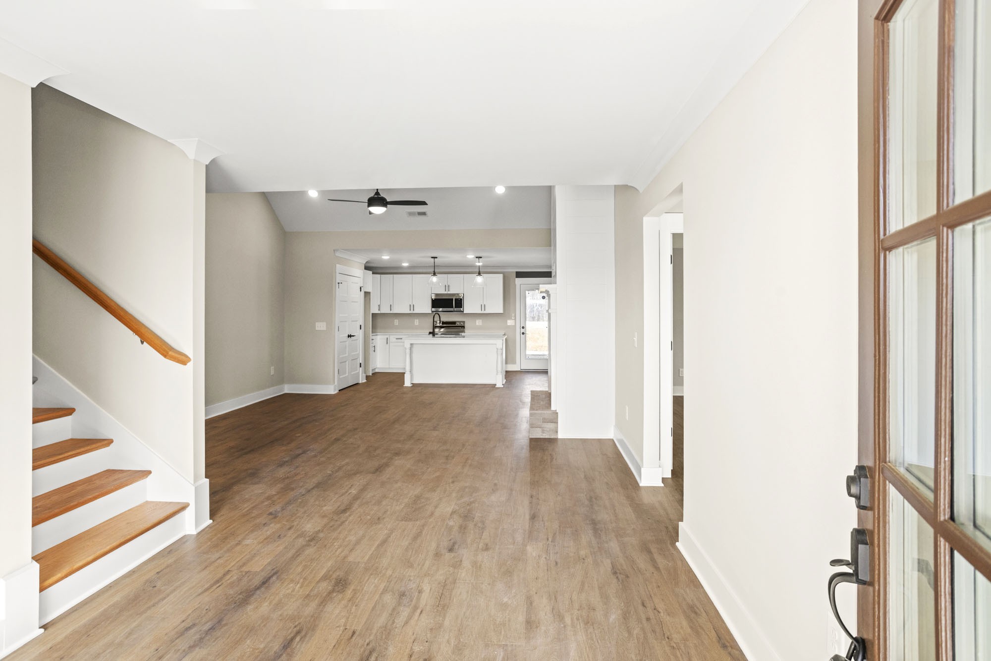 381 Copperas Creek Road Tullahoma, TN 37388 - Photo 4 of 44 a view of a kitchen from the hallway with a wooden floor