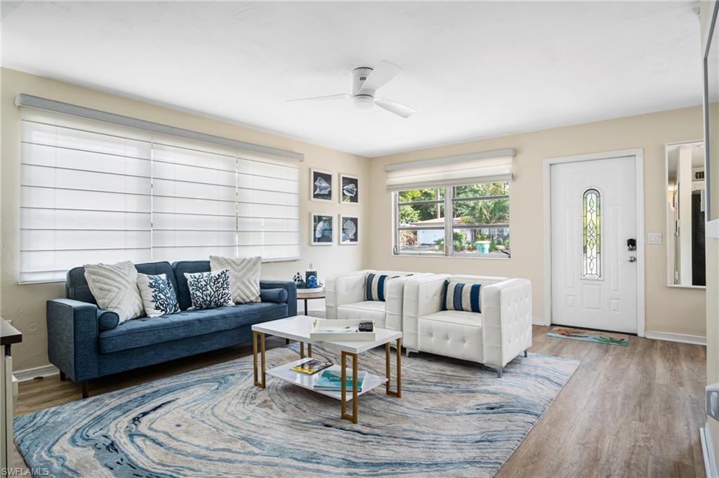 1097 Sperling Avenue Naples, FL 34103 - Photo 16 of 37 a living room with furniture and a large window