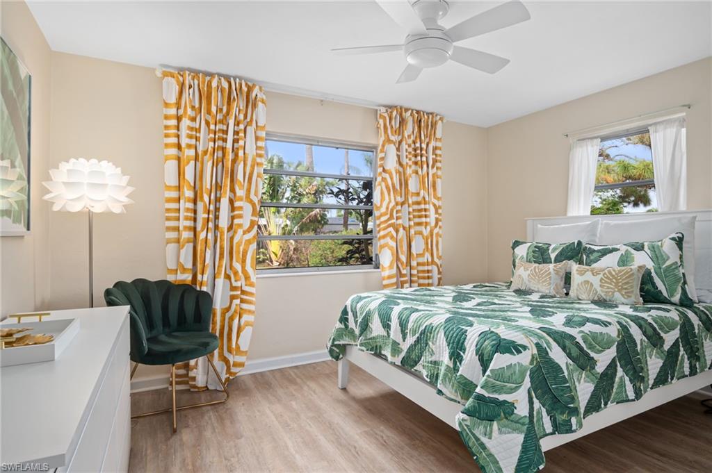 1097 Sperling Avenue Naples, FL 34103 - Photo 23 of 37 a bedroom with a bed and a chair