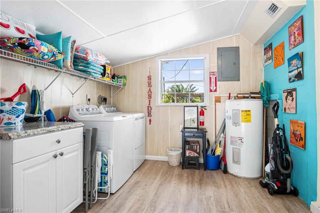 1097 Sperling Avenue Naples, FL 34103 - Photo 27 of 37 a utility room with fridge dryer and washer