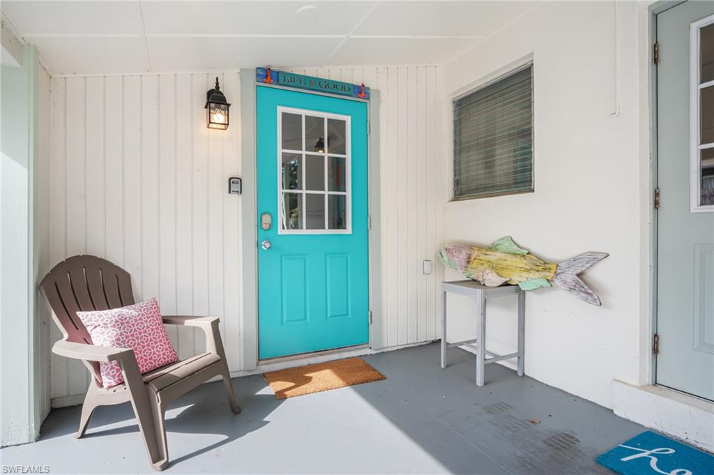 1097 Sperling Avenue Naples, FL 34103 - Photo 28 of 37 a view of a workspace with furniture and a window
