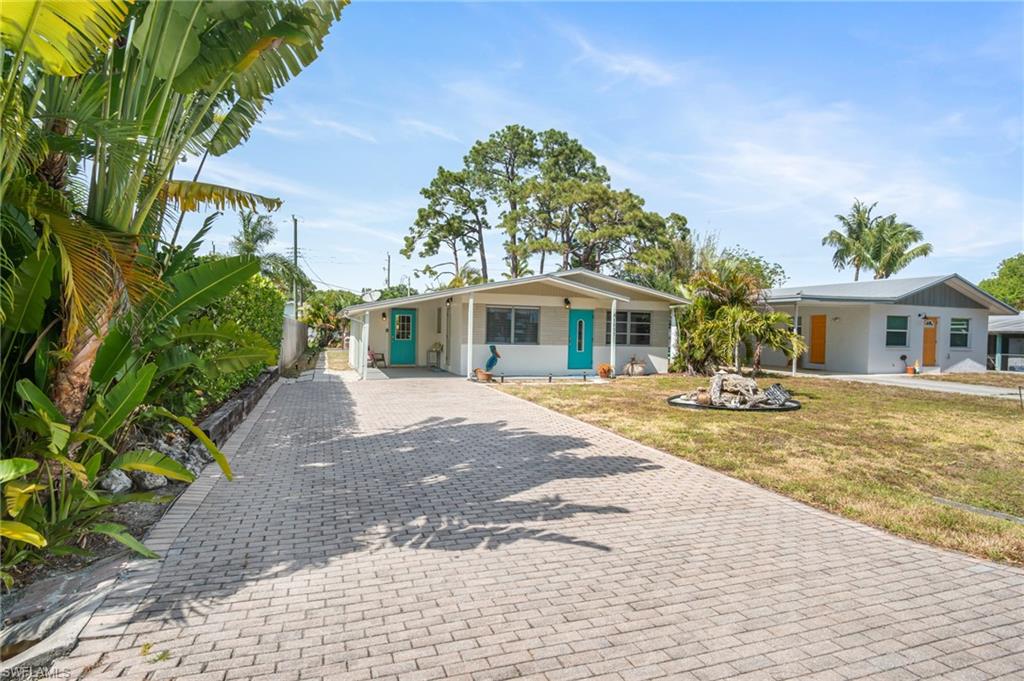 1097 Sperling Avenue Naples, FL 34103 - Photo 37 of 37 a front view of house with yard and green space