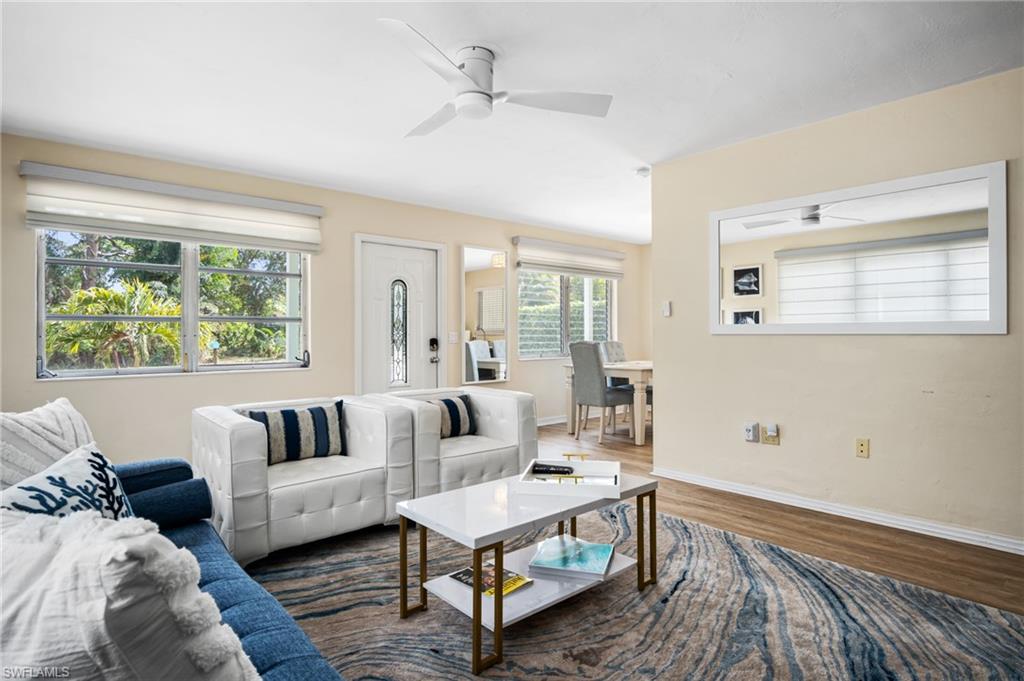 1097 Sperling Avenue Naples, FL 34103 - Photo 4 of 37 a living room with furniture and a large window
