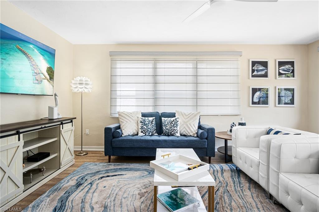1097 Sperling Avenue Naples, FL 34103 - Photo 5 of 37 a living room with furniture and a fireplace