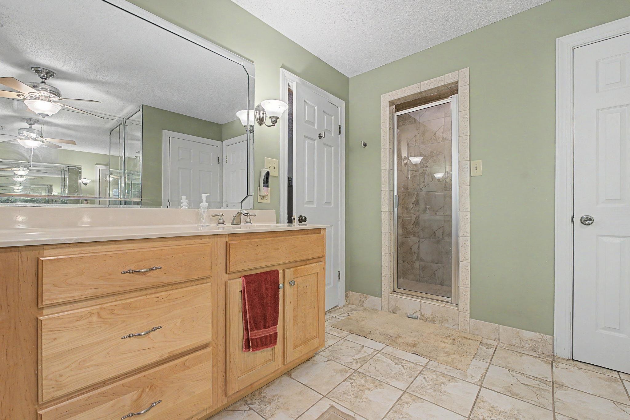 1929 Miller Farms Road Germantown, TN 38138 - Photo 23 of 40 Dual vanity with light wood cabinetry and a continuous countertop