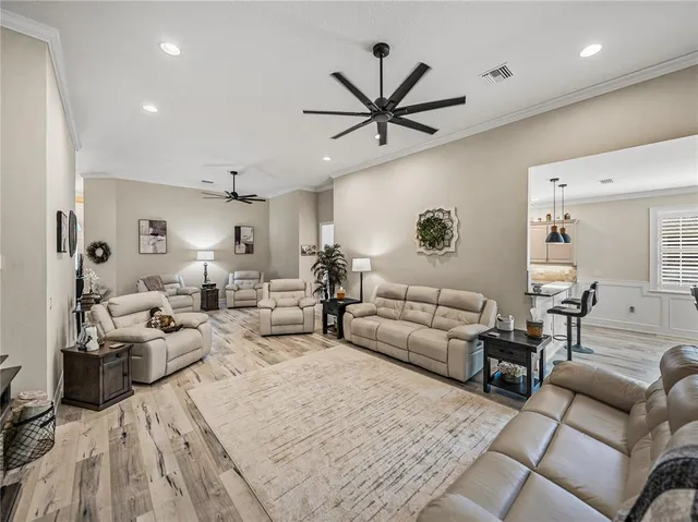 a kitchen with stainless steel appliances granite countertop a stove and a refrigerator