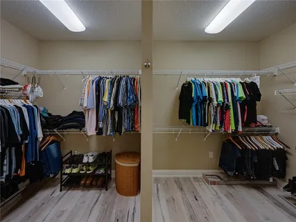 a view of a house with backyard sitting area and garden