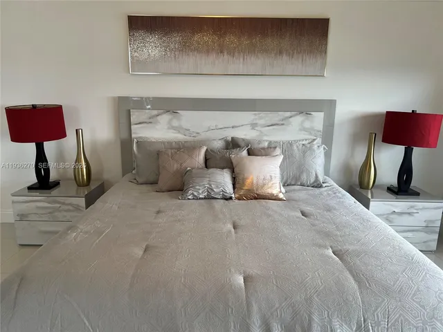 a bathroom with a shower a sink and a mirror