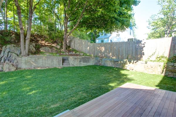 6 Gerring Road Gloucester, MA 01930 - Photo 3 of 22 a view of a backyard with a garden