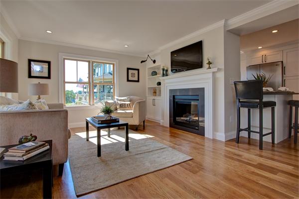 6 Gerring Road Gloucester, MA 01930 - Photo 4 of 22 a living room with furniture a fireplace and a flat screen tv