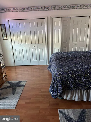 a living room with a couch and a rug