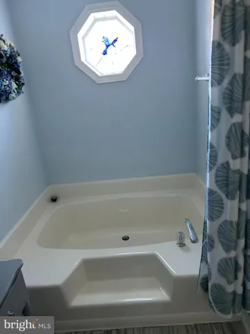 a bathroom with a bathtub