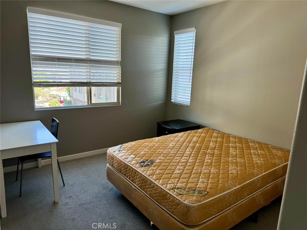 630 Chandler Walk Upland, CA 91786 - Photo 6 of 13 a bed sitting in a bedroom next to a window