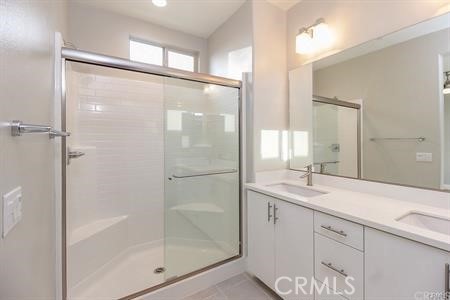 630 Chandler Walk Upland, CA 91786 - Photo 7 of 13 a bathroom with a shower sink and mirror
