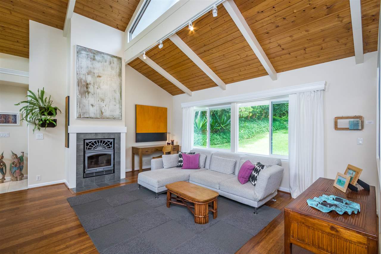 441 Ulumalu Road Haiku, HI 96708 - Photo 11 of 30 a living room with furniture fireplace and a large window