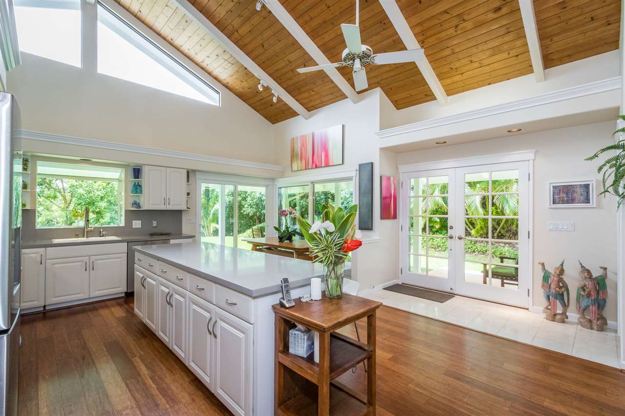 441 Ulumalu Road Haiku, HI 96708 - Photo 5 of 30 a kitchen with sink cabinets and wooden floor