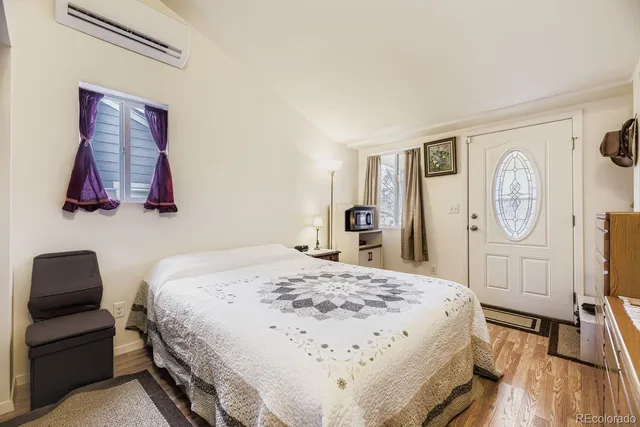 a bedroom with a bed and a dresser